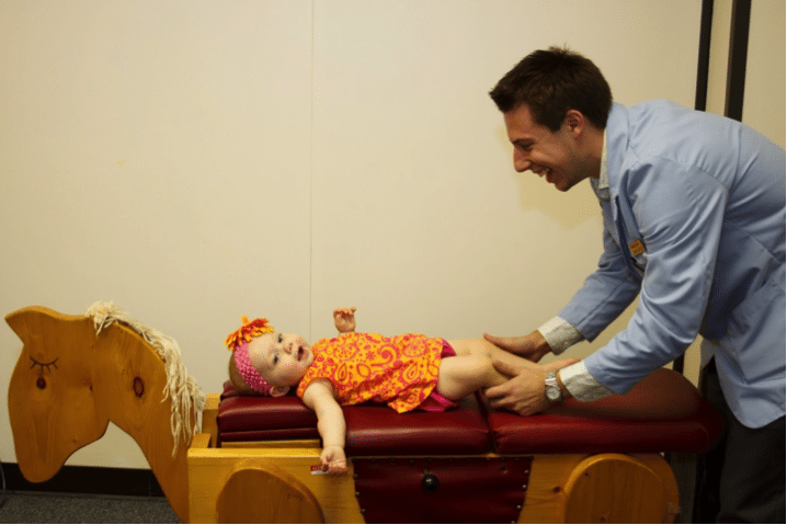 Sherman students learn how to work with young patients during their chiropractic training