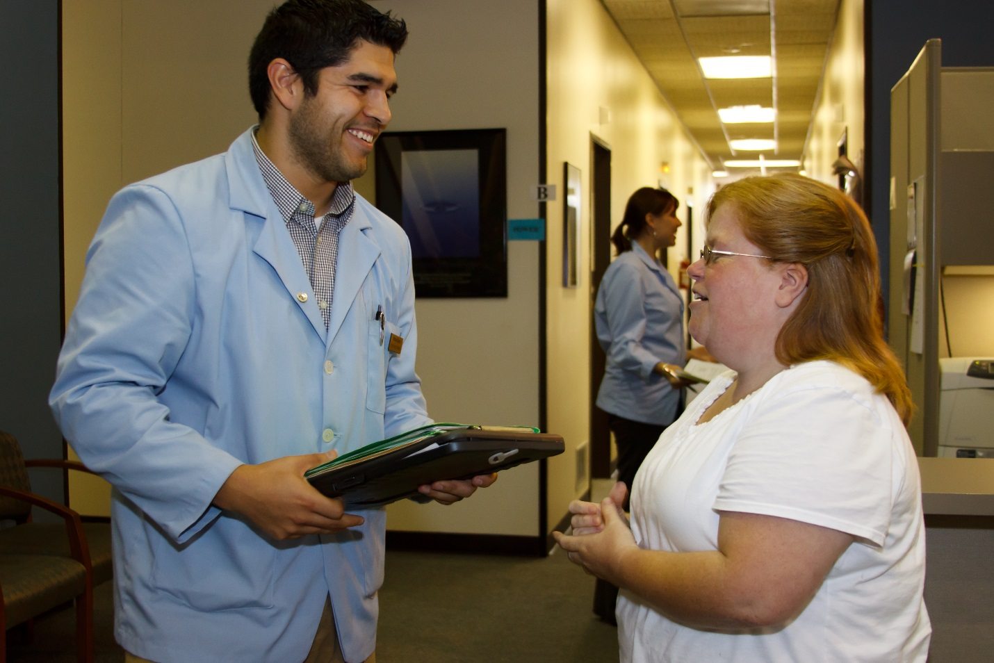 Michelle talking to an intern in the Sherman College Health Center