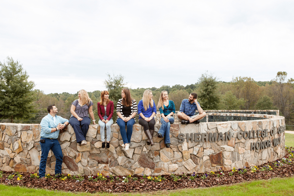 students on honor wall