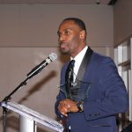 Dr. Land accepting award.