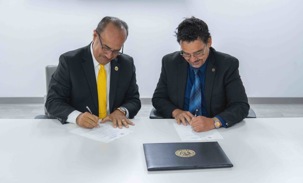 President Cordero and President Torres Ruiz sign admission agreement