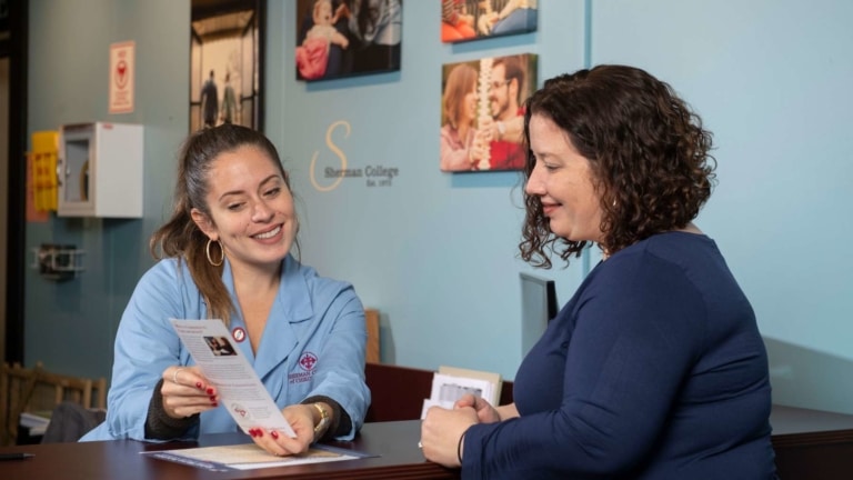 Intern talking to patient