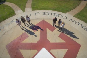 chiropractic college students standing on outside logo
