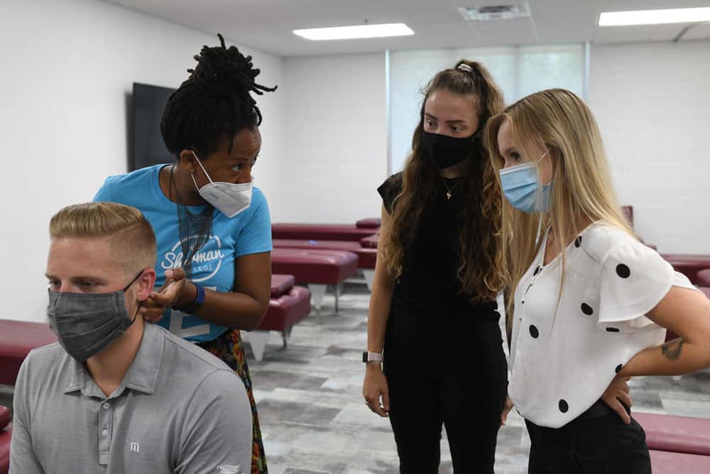 two girl students visiting Sherman College chiropractic class