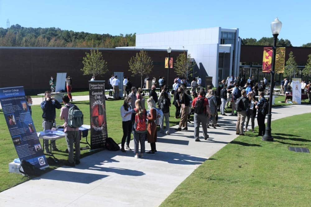 Sherman College students displaying opportunities for campus club involvement