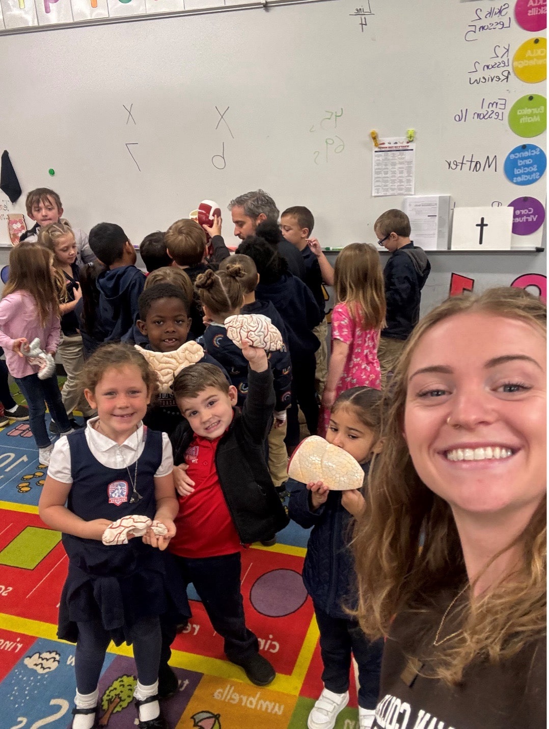 Sherman College chiropractic students and doctors teaching Cherokee Charter Academy students about the nervous system during a school visit.