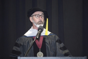 Sherman College June 14, 2025 speaker Bobby Findley, D.C., A.C.P., speaking to graduates of the June 2025 and September 2025 graduating classes.