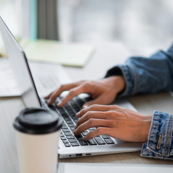 Person using Laptop to Donate Cryptocurrency