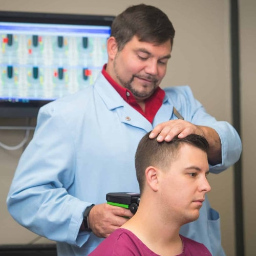 Chiropractic Intern performing an exam before an adjustment