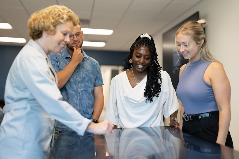 sherman college instructor teaching students using an touchscreen table device