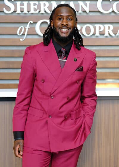 Headshot of Sherman College student ambassador Amir Ross-Obare posing for a professional portrait.