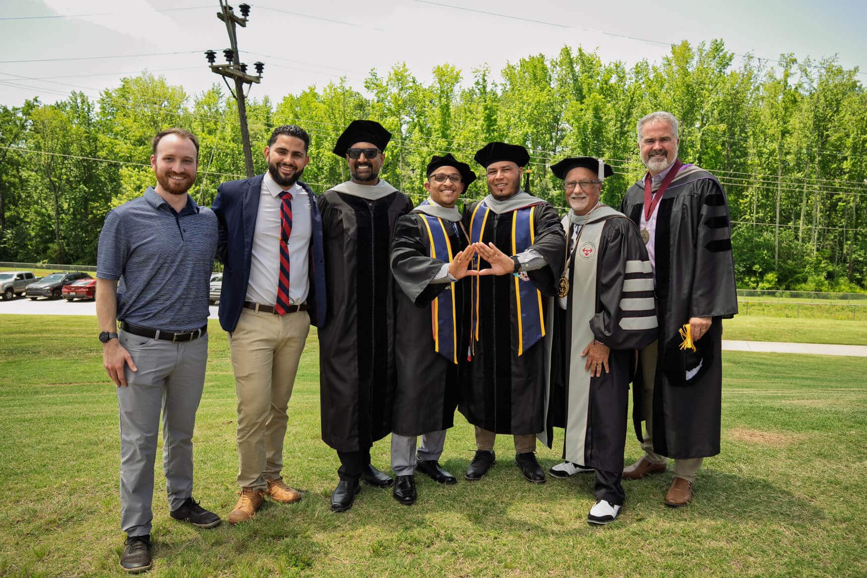 Members of the chiropractic fraternity, Delta Sigma Chi, celebrate following the June 13, 2026, graduation at Sherman College of Chiropractic.